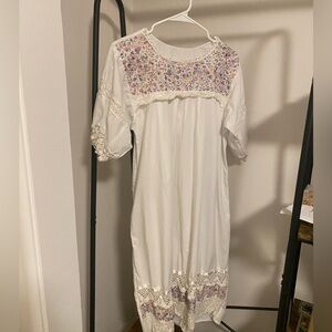 White Mexican Huipil with delicate embroidery.